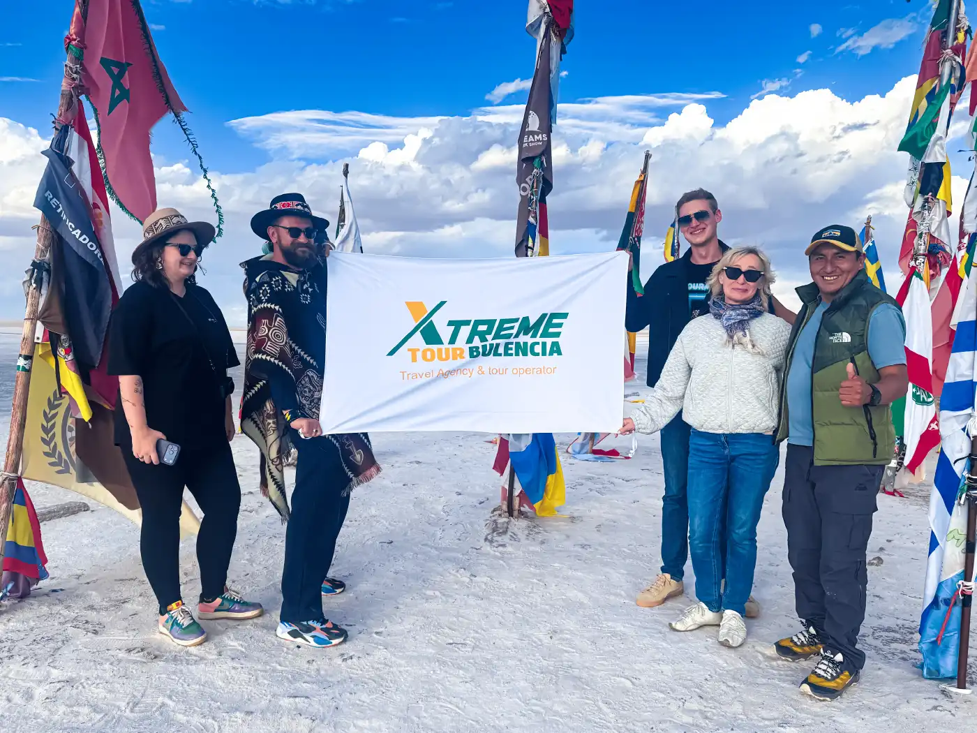 Flags Square: A symbol of world travelers in the salt flats. Colorful international flags waving at the Flags Square near the salt hotel in Uyuni.
