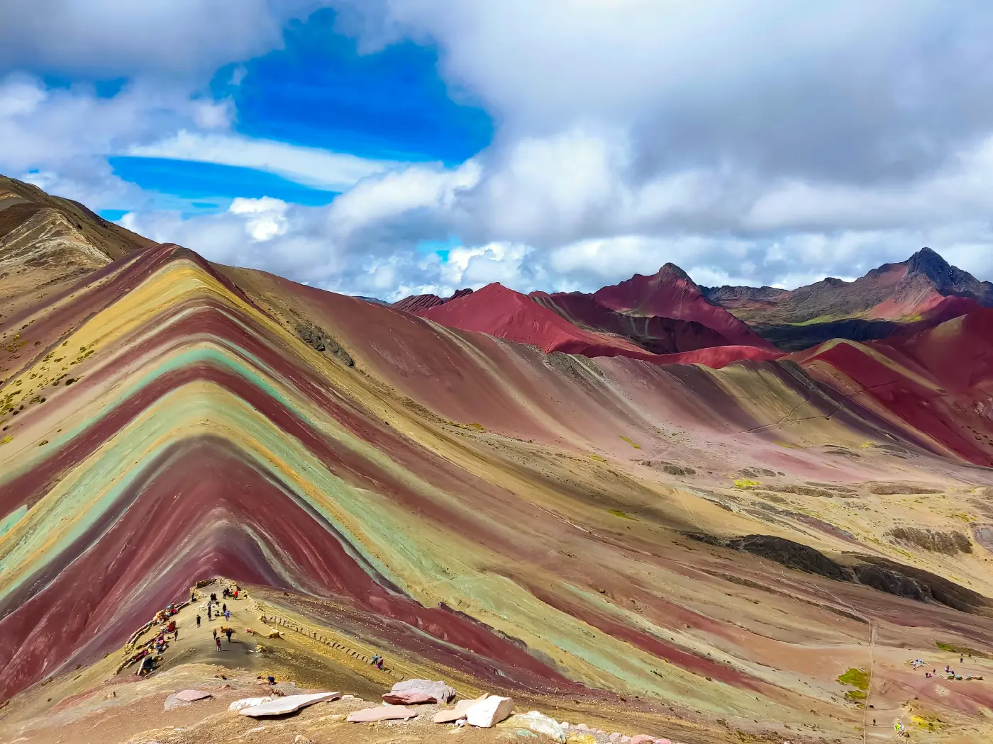 Vinicunca Rainbow Mountain: A natural wonder of the Peruvian Andes Spectacular view of Vinicunca Rainbow Mountain in Cusco, Peru, with red, green, and yellow mineral veins