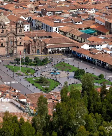 Cusco Plaza de Armas: The vibrant heart of the Imperial City. Panoramic view of Cusco Main Square showing the Cathedral and colonial arches at sunset.