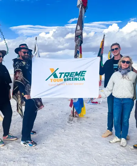 Flags Square: A symbol of world travelers in the salt flats. Colorful international flags waving at the Flags Square near the salt hotel in Uyuni.